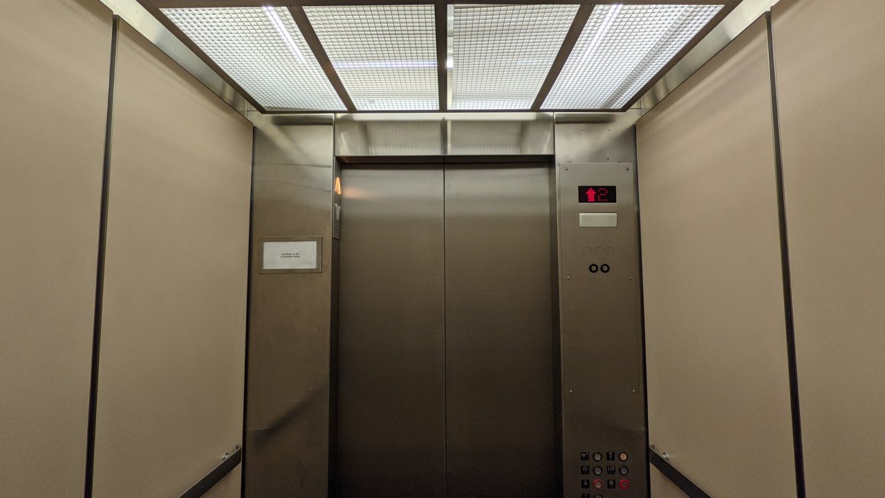 interior-of-a-vintage-montgomery-elevator-with-a-modified-controller.jpg